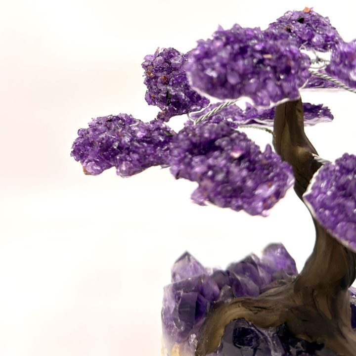 Close-up of amethyst crystal clusters forming the branches of a gemstone tree