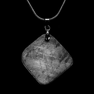 Square meteorite pendant necklace on black background