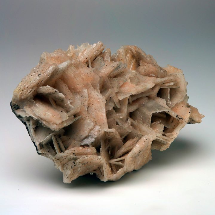 Moroccan Barite crystal cluster side view with layered peach crystals