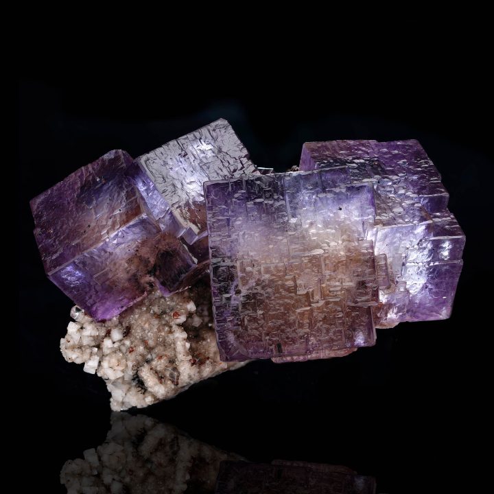 Barite on purple Fluorite mineral specimen from Elmwood Mine