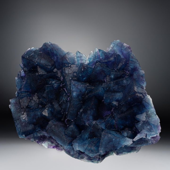Fluorite cluster showing cubic crystals with zoning from China