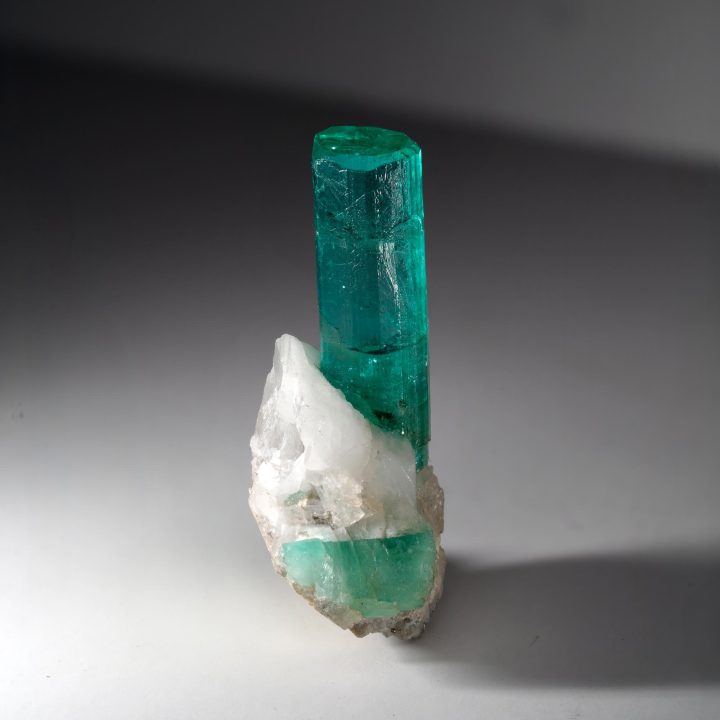 Emerald crystal from Colombia on Calcite host, gemmy green prism