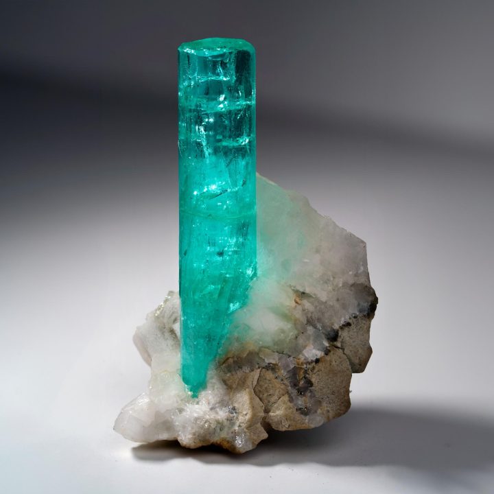 Fine Colombian Emerald on Calcite mineral specimen side view