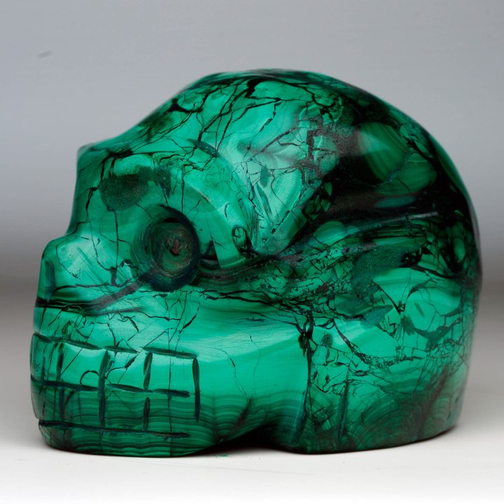 Malachite skull carving side profile