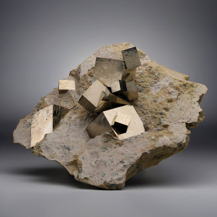 Spanish Pyrite specimen with golden cubic crystals on limestone matrix