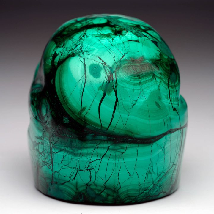 Hand-carved Malachite skull – rear view showing concentric banding