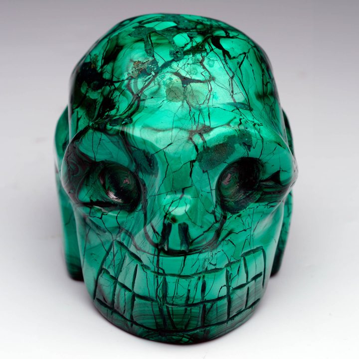 Hand-carved Malachite skull – overhead view with polished surface