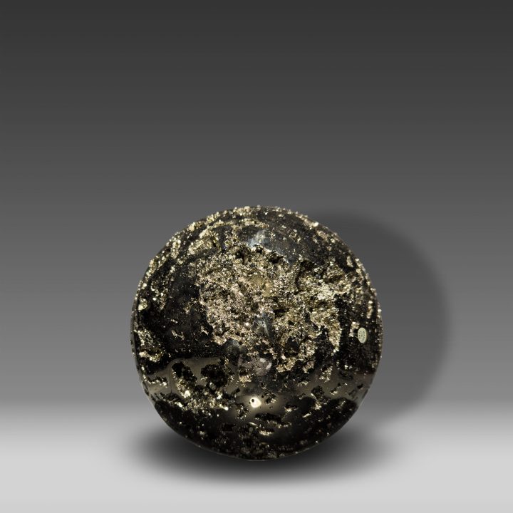 Large hand-polished Pyrite sphere from Peru with golden metallic crystal surfaces.