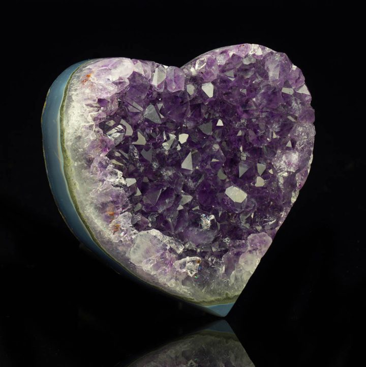 Uruguayan amethyst heart featuring sparkling purple crystal formation