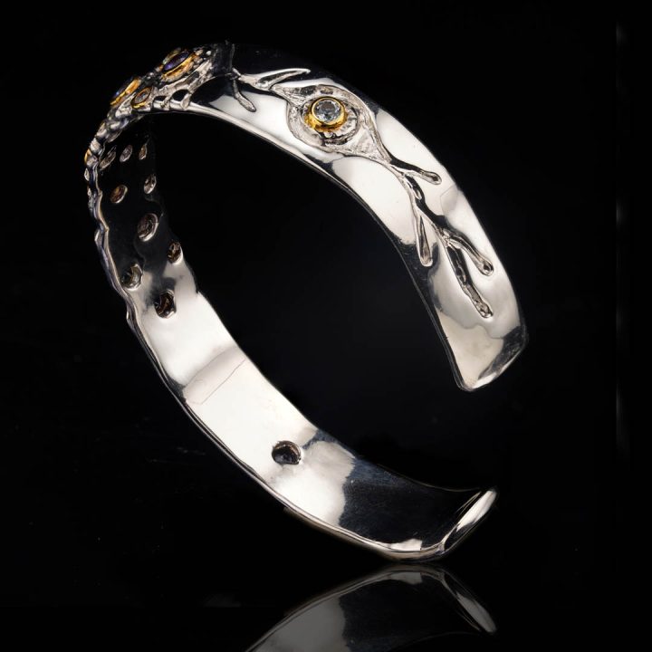 Sterling silver bracelet with Tanzanite and Blue Topaz gemstones and gold accents