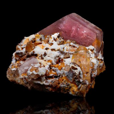 Pink Apatite crystal specimen from Colombia on reflective black background