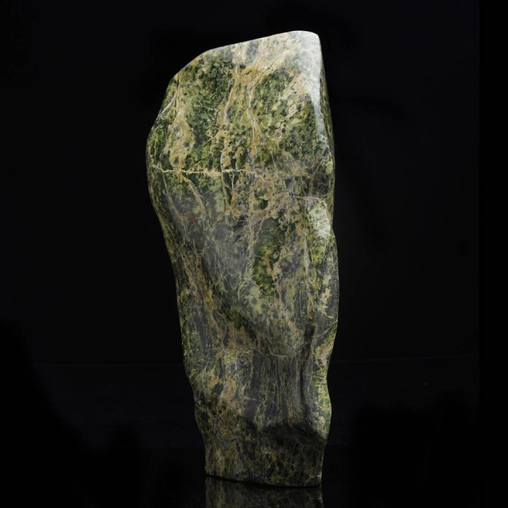 Jade freeform sculpture with natural green veining