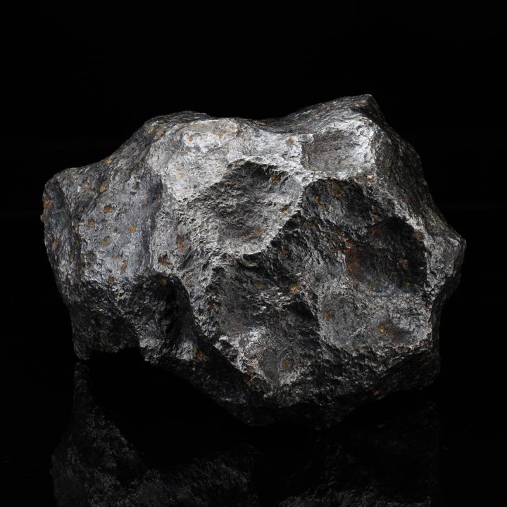 Massive Campo del Cielo meteorite showing raw iron texture and natural shape