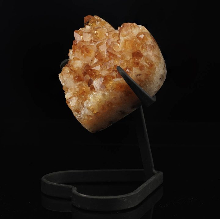 Decorative citrine crystal heart mounted on metal stand