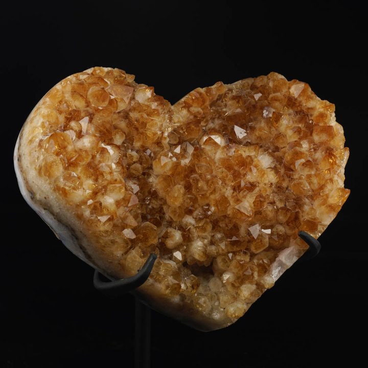 Medium citrine heart crystal as a collector display piece