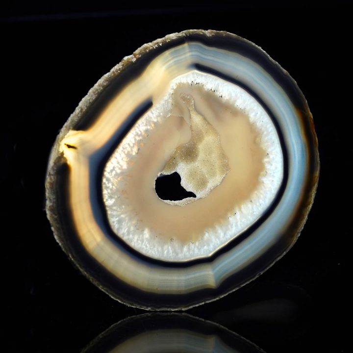 Geode-style agate slice with layered earthy tones