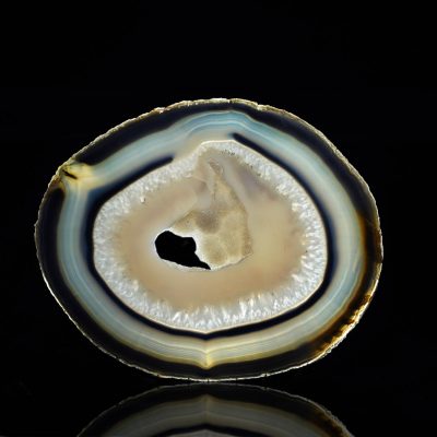 Natural Brazilian agate slice with banded concentric pattern
