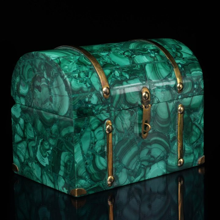 Malachite decorative box with lid closed, showcasing natural green banded stone patterns and polished surface