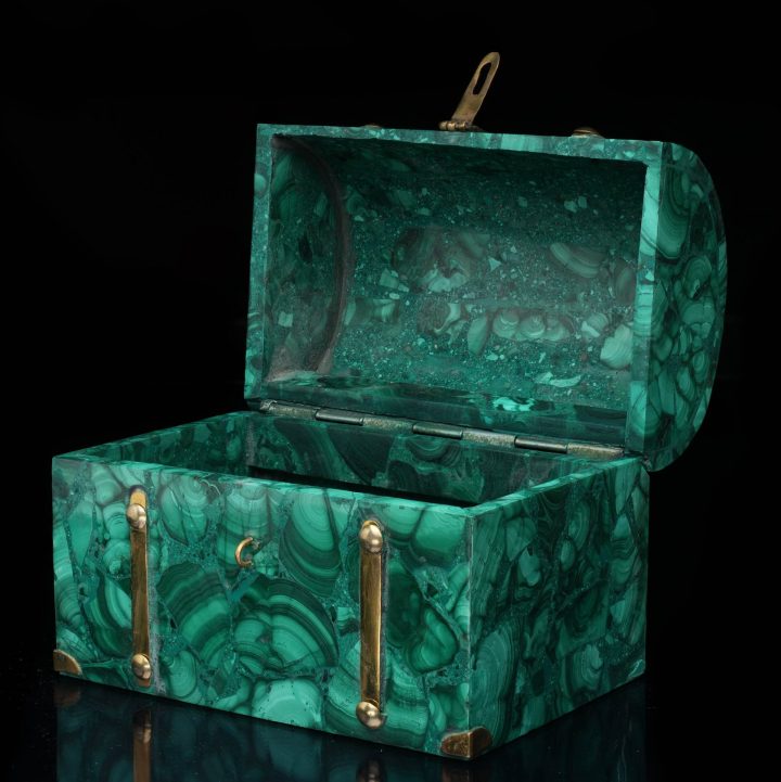 Open malachite box viewed from above, showcasing polished green banded stone interior and natural patterns
