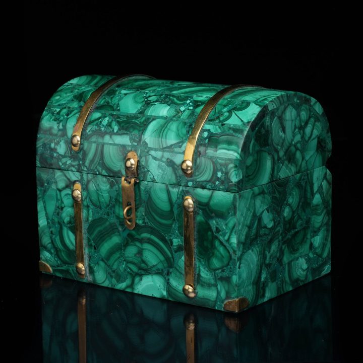 Closed malachite stone box displaying rich green veining and polished finish with decorative accents