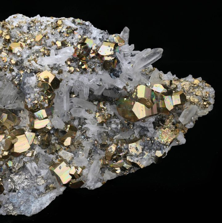 Close-up of pyrite cubic crystals on quartz, highlighting metallic gold crystal geometry and texture