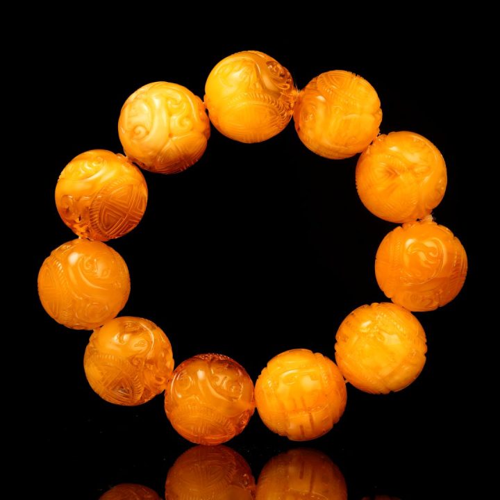 Hand‑Carved Asian Symbolic Amber Beaded Bracelet