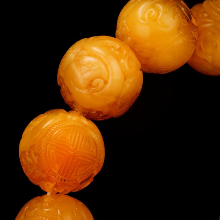 Hand‑Carved Asian Symbolic Amber Beaded Bracelet