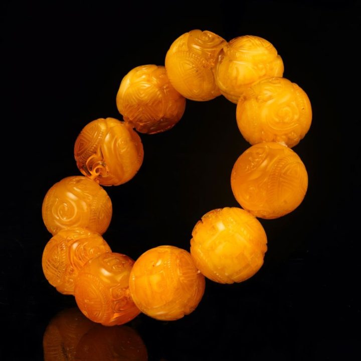 Hand‑Carved Asian Symbolic Amber Beaded Bracelet