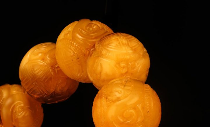 Hand‑Carved Asian Symbolic Amber Beaded Bracelet