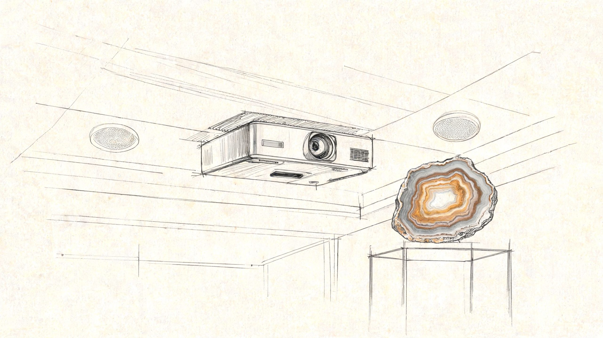 A line sketch of a projector mounted on a ceiling near a decorative geode display stand.