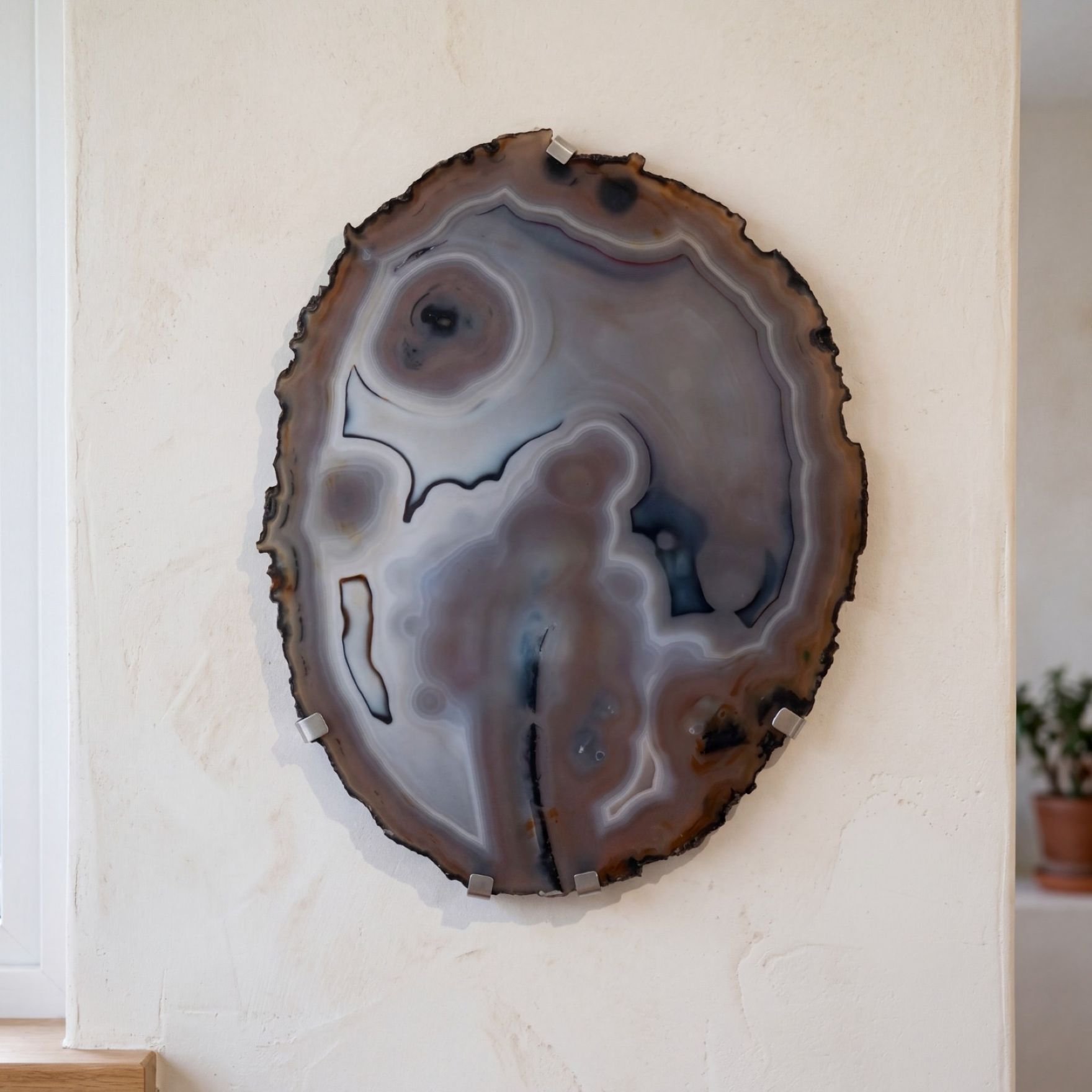 A hand-drawn sketch displaying a curated collection of decorative agate stone slices for interior wall display.